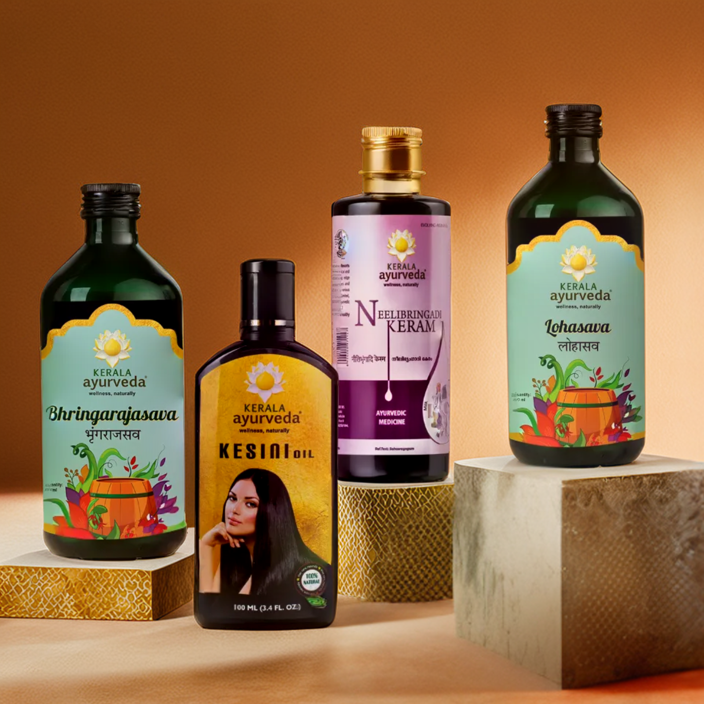 A collection of four Kerala Ayurveda bottles on pedestals, part of the Healthy Hair Kit for Women – Growth & Shine. The bottles visible are Bhringarajasava Asava, Kesini Oil, Neelibringadi Keram, and Lohasava. – Kerala Ayurveda India