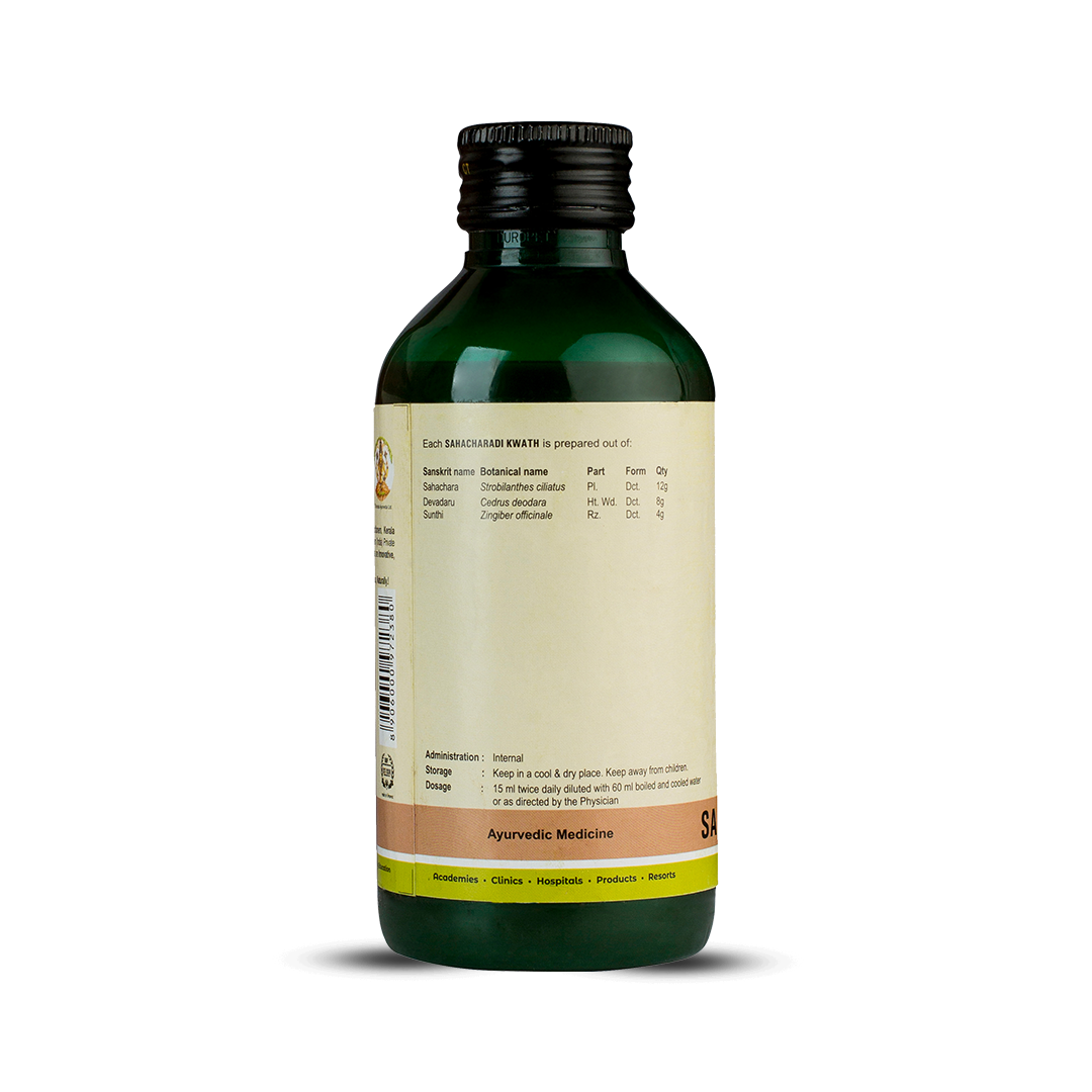 Side view of the dark green glass bottle of Kerala Ayurveda Sahacharadi Kwath, showing a detailed list of ingredients prepared per 15 ml, including Sanskrit name, botanical name, part, form, and quantity. Administration, dosage (15 ml twice daily diluted with 60 ml water), and storage instructions are also visible. – Kerala Ayurveda India