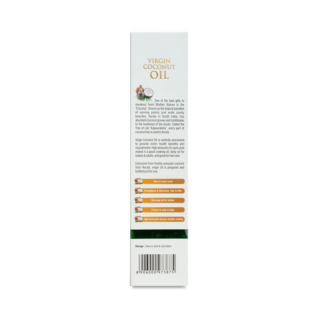Side view of the Kerala Ayurveda Virgin Coconut Oil bottle's packaging, describing coconut as a "Tree of Life," highlighting its benefits like being rich in lauric acid, strengthening hair, being a massage oil for babies, and perfect for cooking. – Kerala Ayurveda India